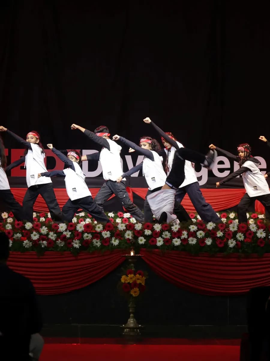 Students performing a group dance at TEDxDavangere 2025