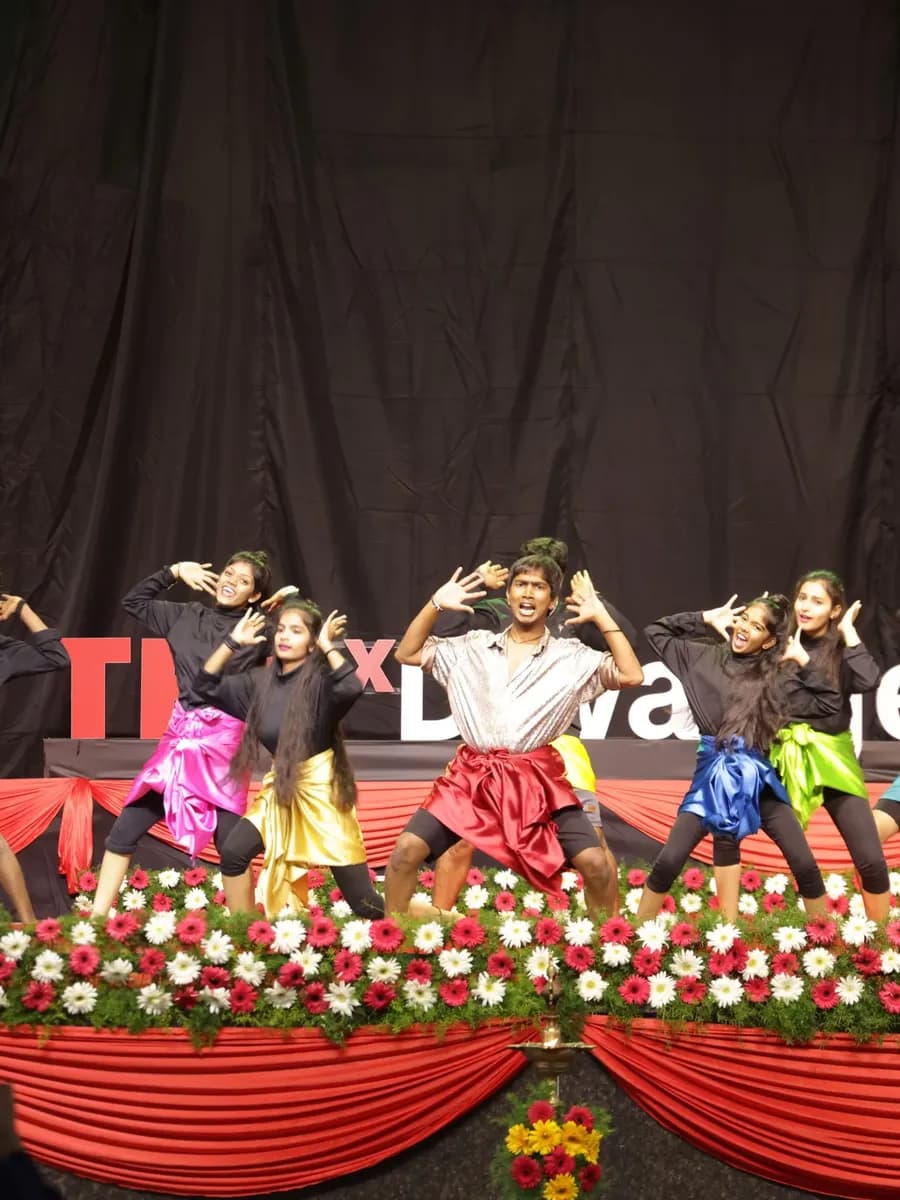 Dancers in coloured costume performing at TEDxDavangere 2025