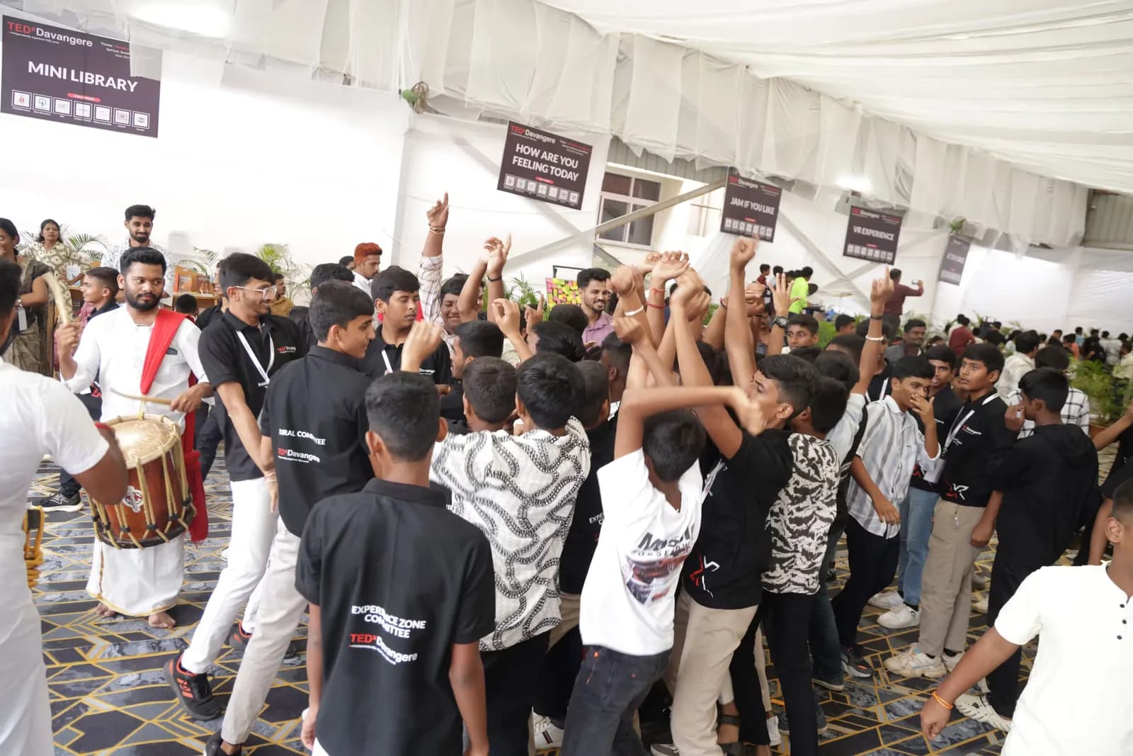 Delegates dancing to a chende drummer between sessions