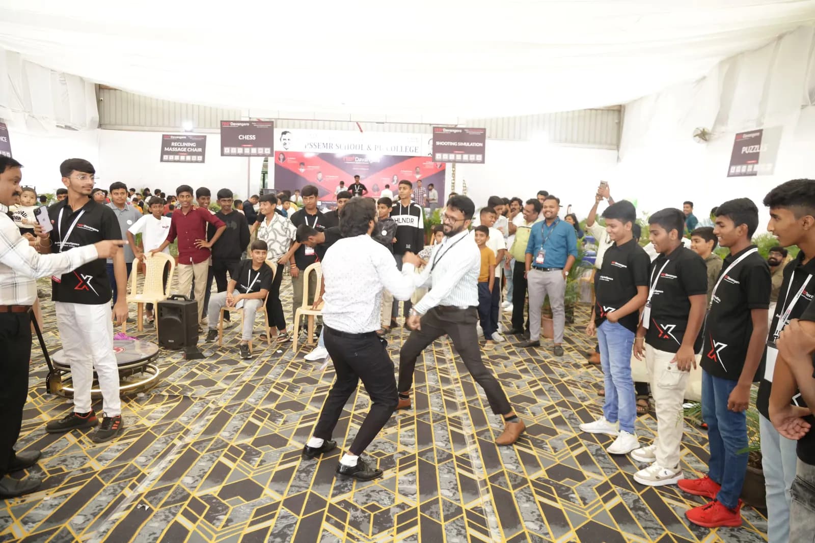 Delegates dancing in a circle during the evening break