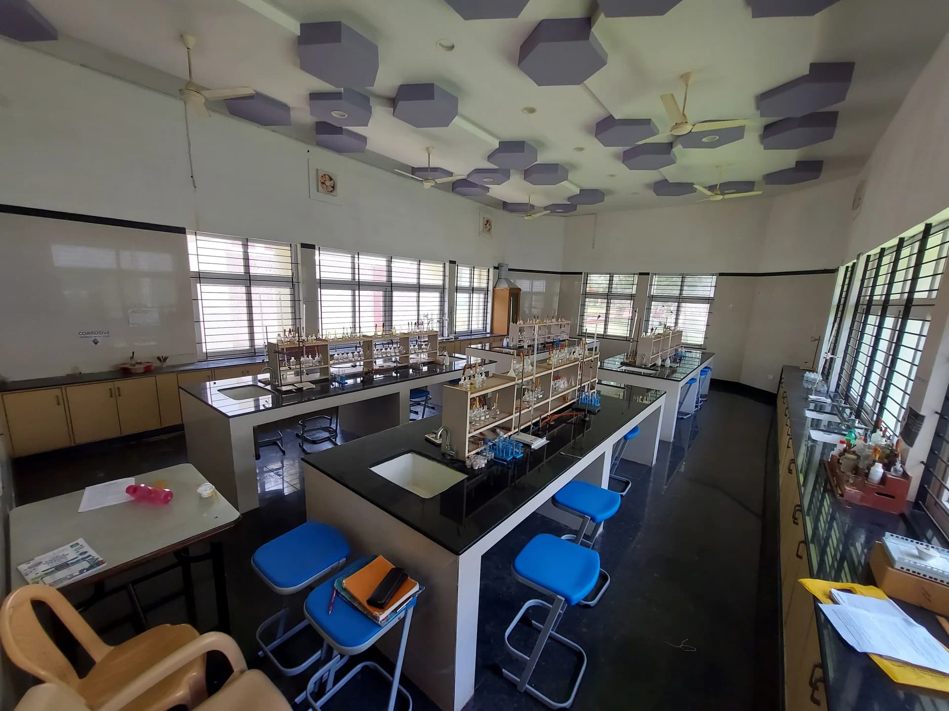Chemistry laboratory with fume cupboard, reagent racks and work benches
