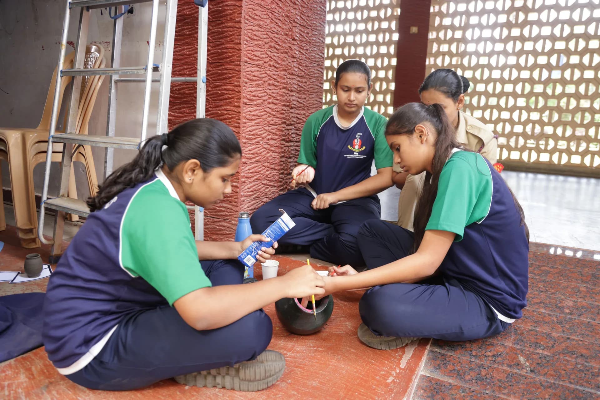 PSSEMR students painting earthen pots